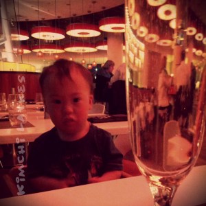 Not all that pleased at dinner.  Mommy, on the other hand, was very pleased with her champagne.