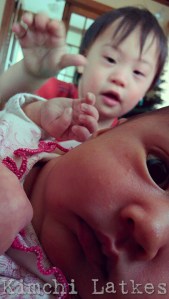 Picture focused on Sparrow with an alarmed expression, LP's face is blurry in the background, his hand is reaching for Sparrow's face.